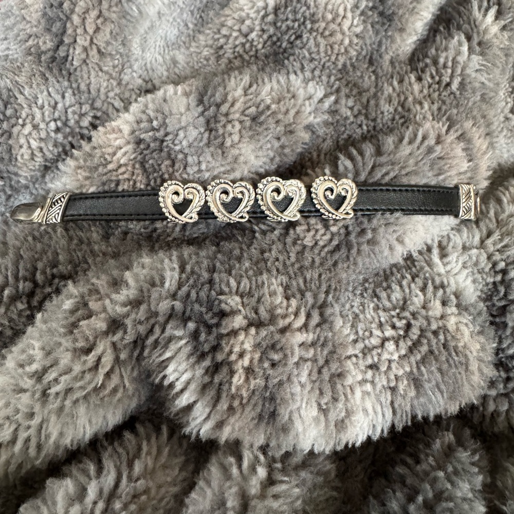 Consignment item..
Silver toned and black leather bracelet